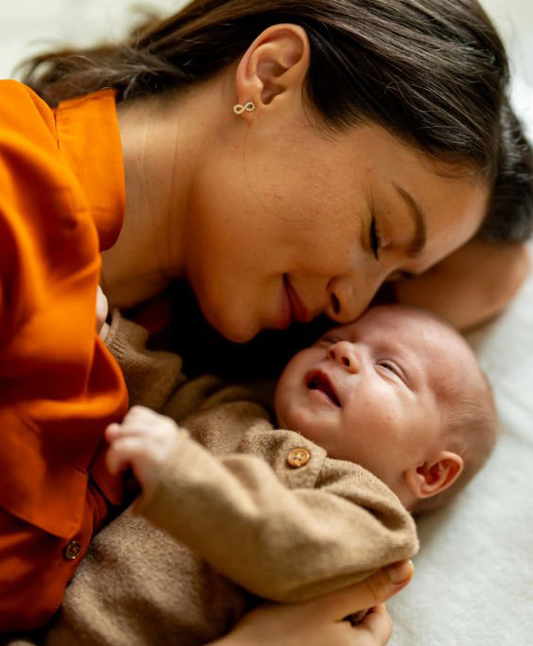 Mother and baby lying down