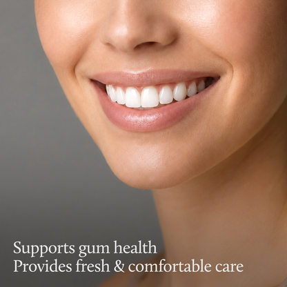 Close-up of a smiling woman's mouth and teeth with the text 'Supports gum health Provides fresh & comfortable care' at the bottom on a gray background.